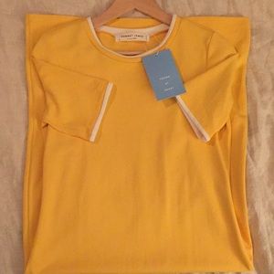 Yellow play dress with white piping